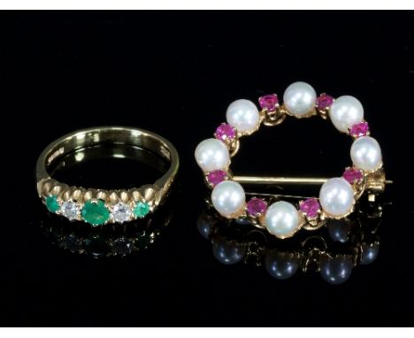 An 18ct gold, emerald and diamond five-stone ring, stamped maker's mark R & T, size N½ and a circular brooch set with rubies 