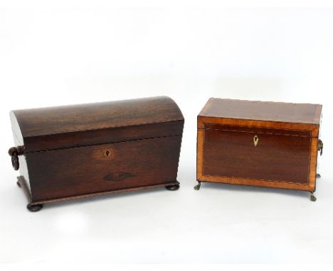 A Regency rosewood tea caddy with domed cover and ring handles to the sides, 34cm wide and a satinwood inlaid box on paw feet