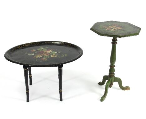 An oval painted toleware tray, 76cm wide on associated stand and a painted tripod table