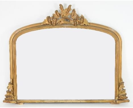 A Victorian arch top overmantel with moulded frame and carved application, the plate 70cm x 97cm