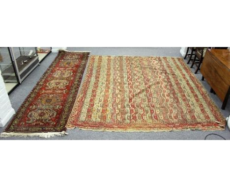 A Turkish carpet, the field of multiple wavy bands, cut down, 300cm x 253cm and a modern runner   Condition Report:  Lot 568T