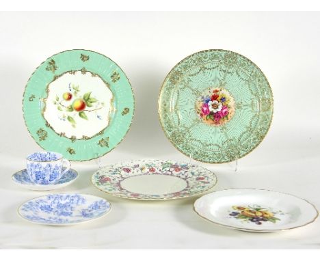 Three Royal Worcester plates, decorated with fruit and flowers, signed Townsend, Price and Seeman, together with a dinner pla
