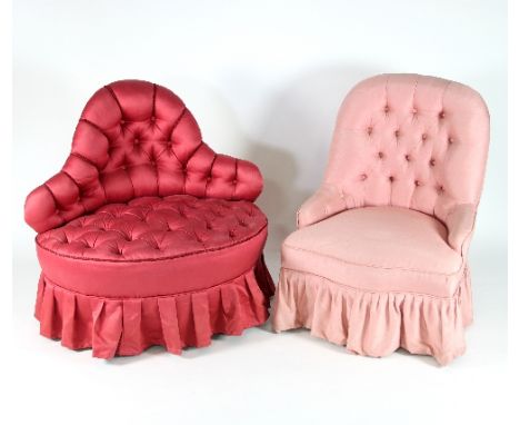 A Victorian boudoir chair, button upholstered in raspberry chintz fabric with burgundy cord detail, on turned legs with casto