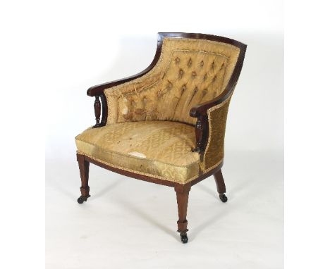 An Edwardian tub-shaped single chair with turned supports to the arms, button back and upholstered seat on square taper legs 