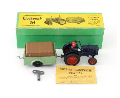 A Britains Clockwork Series No 139F Tractor and Trailer set comprising a Fordson Major Tractor with seated driver and a Mecha