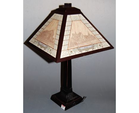 A modern painted metal column table lamp with shade decorated with various scenes from Bramford
