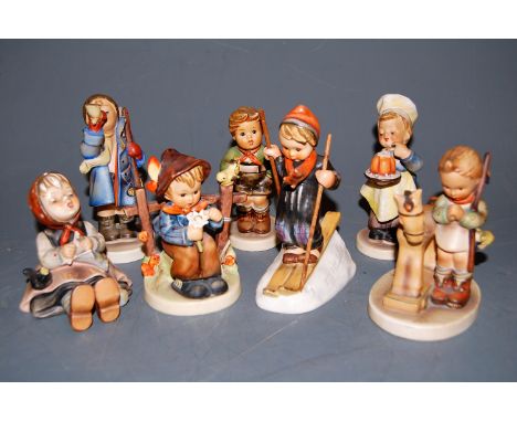 Eight various Hummel figures, to include She Loves Me She Loves Me Not   Condition Report / Extra Information  Seated girl wi
