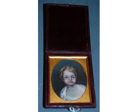 English school, early 20th century, portrait of a child, overpainted print in fitted leather case, 7.5x6cm