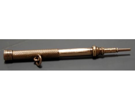 A 9ct gold propelling pencil with engine turned decoration 