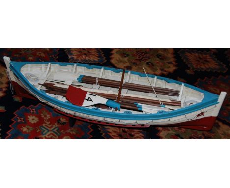 A wooden scale model of a rowing boat, on display stand    Condition Report / Extra Information  Length 79cm, width 24cm, hei