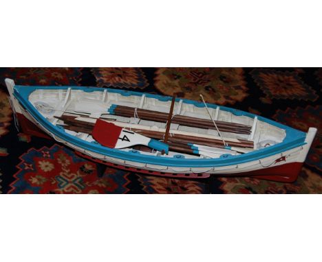 A wooden scale model of a rowing boat, on display stand    Condition Report / Extra Information  Length 79cm, width 24cm, hei