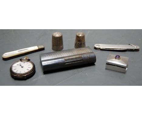 A late 19th century silver cased ladies fob watch together with a Dunhill pocket cigarette lighter, a silver bladed mother of