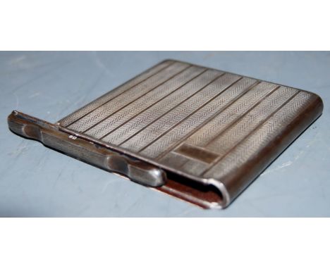 A George V silver pocket cigarette case, having unusual sliding top with spring-loaded interior, and engine turned exterior