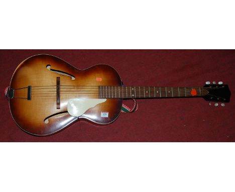 A Bavarian acoustic guitar, bearing label for Farmus-Werke, in soft carry case   Condition Report / Extra Information  Light 