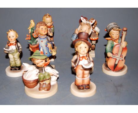 Eight various Hummel figures, to include Playmates   Condition Report / Extra Information  Pair of drummers - missing tip of 