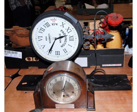 A reproduction Taverstock & Jones Paddington Station wall clock; together with a 1950s oak cased mantel clock (2)