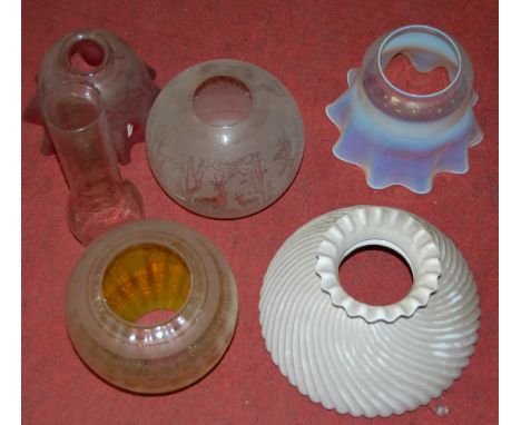 A Victorian yellow tinted and etched glass oil lamp shade, of globular form; together with one other similar vaseline glass e