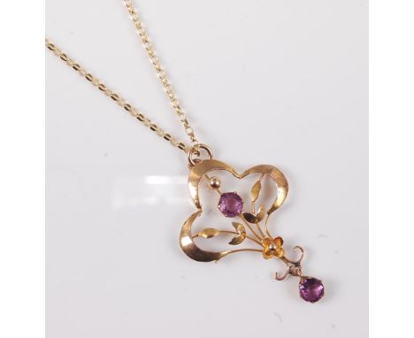 An Edwardian style amethyst pendant, approx. 3.5cm long, faintly stamped '9ct' to reverse, on modern chain with clasp stamped
