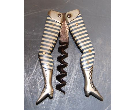 A 1930s German novelty ladies legs pocket corkscrew having blue & white striped celluloid legs and calf length boots   Condit