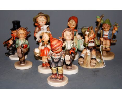 Eight various Hummel figures, to include Mountaineer   Condition Report / Extra Information  Girl with basket - handle to bas