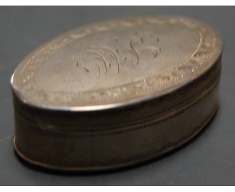 A George III silver pocket snuff box of oval form, having bright cut decoration and gilt washed interior, maker IT, Birmingha