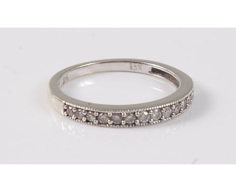 A 9ct diamond half hoop ring, the small round diamonds, total estimated weight approx. 0.20cts, bead mounted to a channel wit