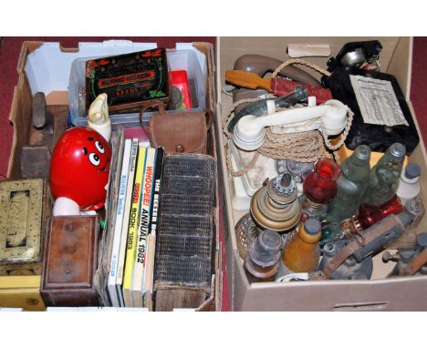 Two boxes of miscellaneous items, to include; glass and stoneware bottles, childrens volumes, lithograph printed tins, metalw