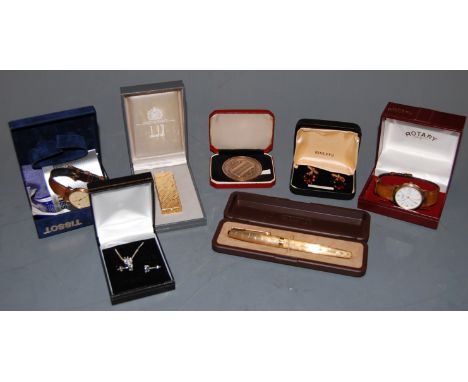 A Dunhill textured gold plated cased pocket cigarette lighter, boxed; together with a boxed Parker gold plated cased ballpoin