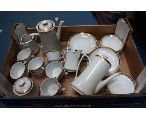 A large quantity of Coffee Cups and saucers and two coffee pots, milk jug and sugar bowl, saucers and plates in white with a 