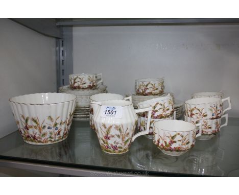 A pretty Teaset including eleven straight sided ridged cups, ten saucers, twelve tea plates, slop bowl and milk jug with hare