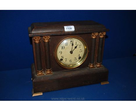 A circa 19th c. Oak American mantle Clock, having moulded rectangular top over two pairs of applied and turned Corinthian  st