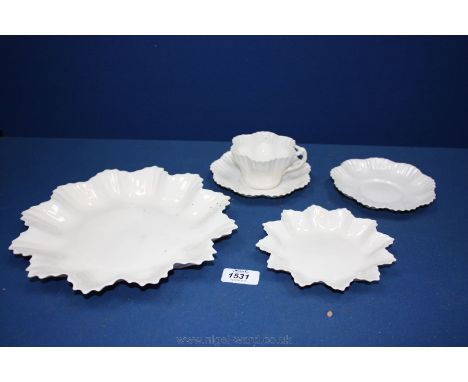 Two Belleek white Plates, plus a Cup - a/f and two similar white Saucers 