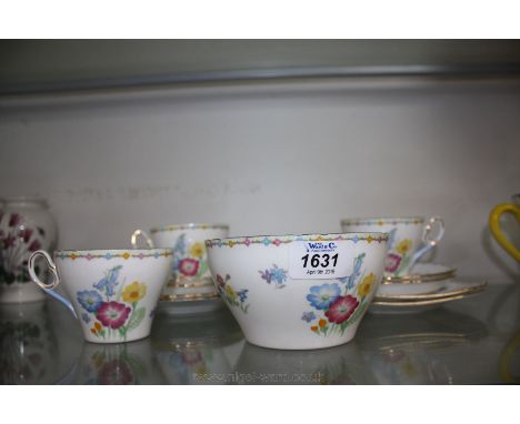 A Shelley first edition part Teaset with wild flower pattern and comprising three cups, four saucers, four tea plates and sug