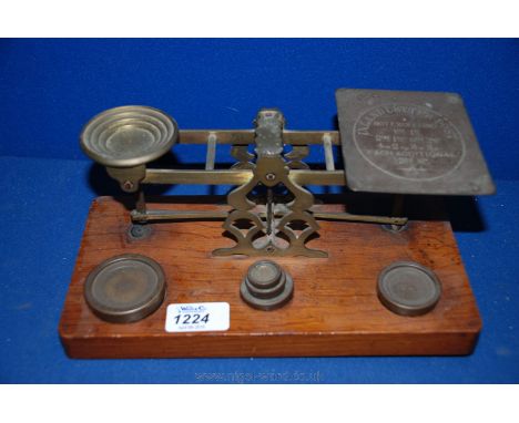 A set of Postal Scales with weights up to 8oz