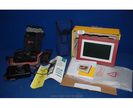 A Pentax DX auto focus Camera, Olympus Superzoom 120, Kodak Easy Share P720 7'' digital frame and a Garmin GPS 40