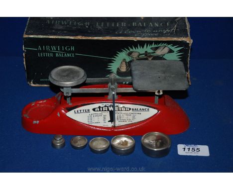 A boxed set of Airweigh letter balance Scales, made by Universal Woodworking Co Ltd, Birmingham.