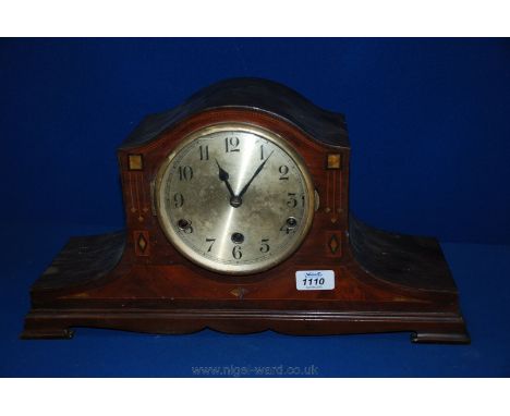 An Edwardian Mahogany cased Mantle Clock, having dome top case with curved sides, boxwood, ebony and walnut inlay to the fron