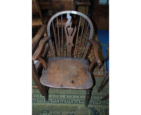 An early 19th c. low Ash/Oak Elbow Chair, having pierced fret cut splat (a/f) in stick back, swept arms with solid shaped elm