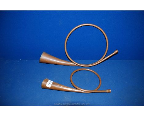 Two circular hunting Horns