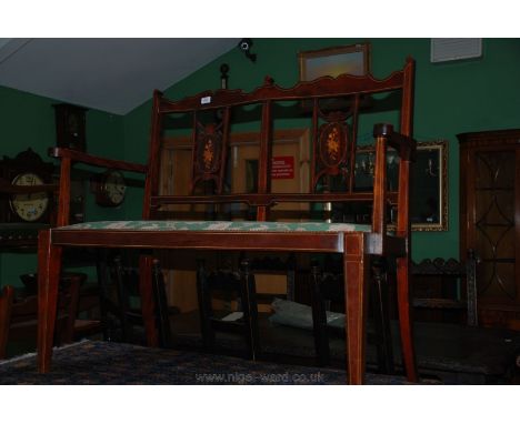 An Edwardian Mahogany salon Sofa with twin chair back style back, pierced fret cut inlaid splats and scroll arms, applied gre