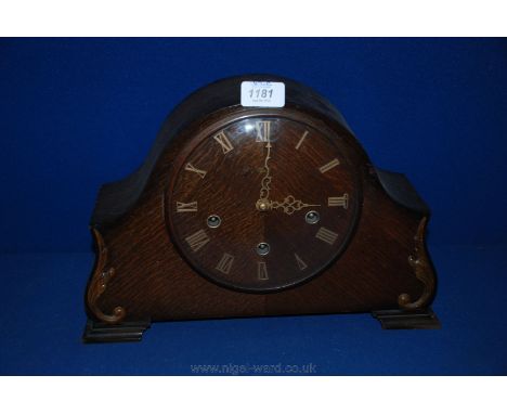 A circa 1920 Oak cased Smiths Enfield mantle Clock having dome top with applied leaf moulding to the front, on shaped bracket