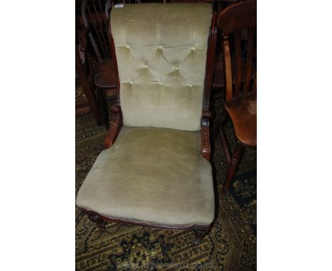 A 19th century mahogany show frame salon chair.  Button upholstered back in scroll top reeded supports with central corbel  s