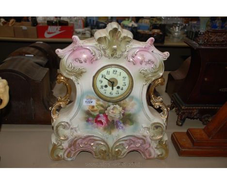 A large continental style 19th c. ceramic Mantle Clock with gilt and floral decoration, white enamel Arabic numeral face with