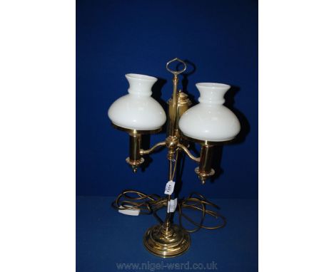 A Brass double Desk Lamp with white glass shades.