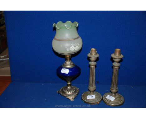 A pair of Brass Table lamp bases and a Victorian glass Table Lamp with blue reservoir and lamp base