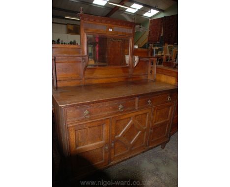 A late 19th c. Oak mirrorback Sideboard having ball finial pediment on reeded section above the rectangular bevel plate mirro