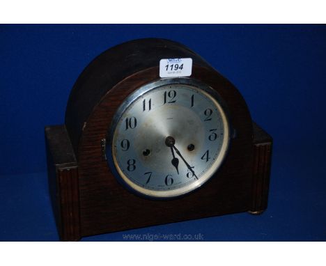 A circa 1920 Enfield Oak cased Mantle Clock, the dome top with platform sides with applied reeded mouldings and on chrome but