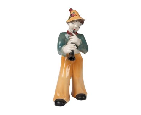 A painted glazed figure of an Austrian boy playing the horn. High quality art deco figure. Dimensions: 9"L x 7"W x 16.5"HCond