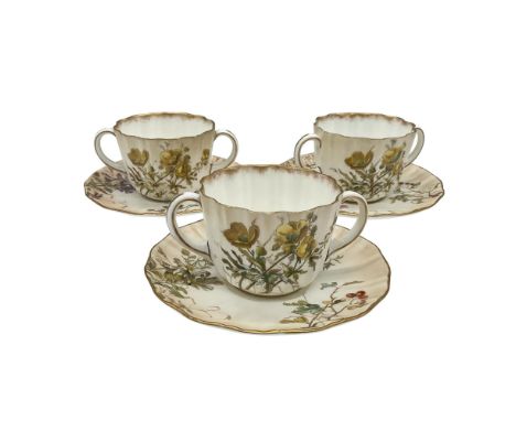 Beautiful hand painted set decorated with delicate multicolored flowers on a white and brown ground, scalloped and gilded rim