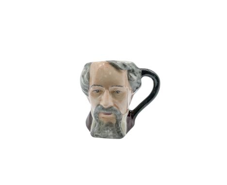Light grey beard, dark brown coat and a plain black handle. Part of the Charles Dickens Commemorative Tiny Set, celebrating t